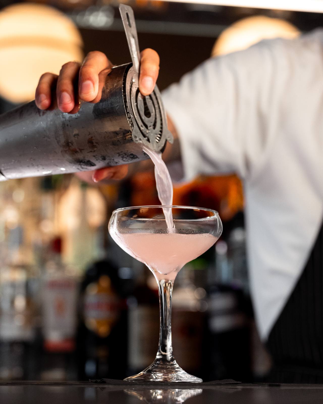 A cosmopolitan strained into a coupe at the Baci bar