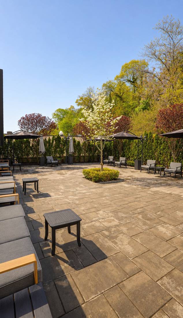 The Rooftop private outdoor patio with umbrellas and lounge seating