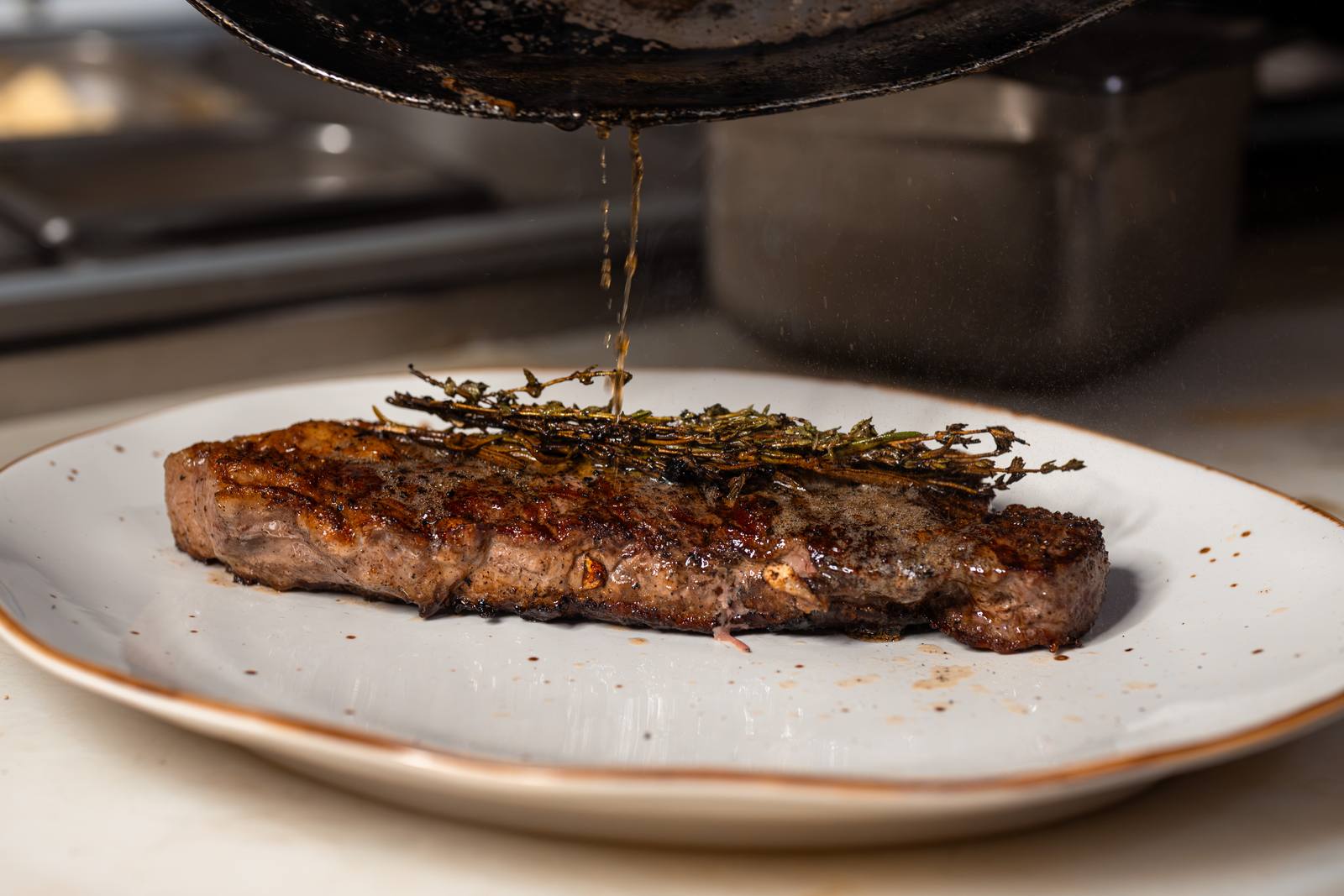 Steak finished with thyme butter at Baci
